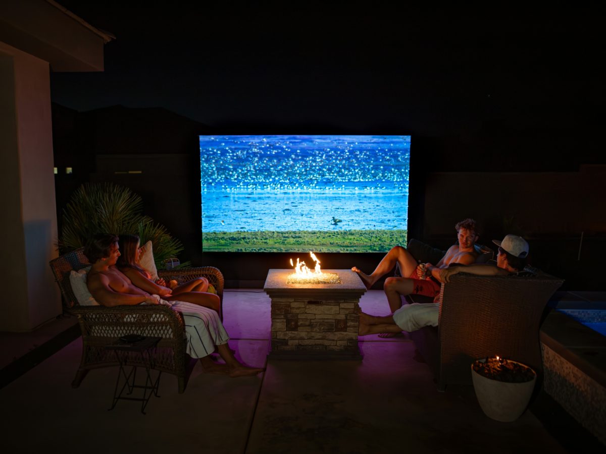 Friends watching together outdoors with IPTV Gang